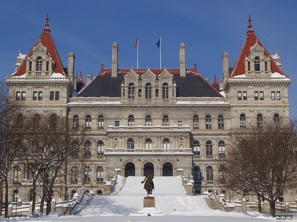 The New York State Capitol in Albany, a granite building with red-roofed towers